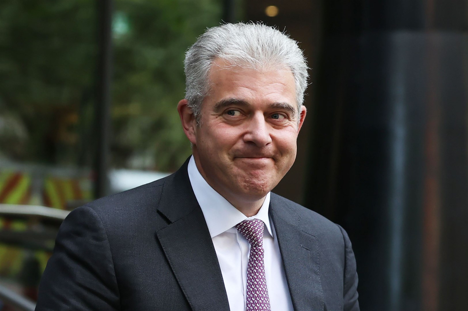 Sir Brandon Lewis leaving the Clayton Hotel in Belfast after giving evidence to the UK Covid-19 Inquiry (Liam McBurney/PA)