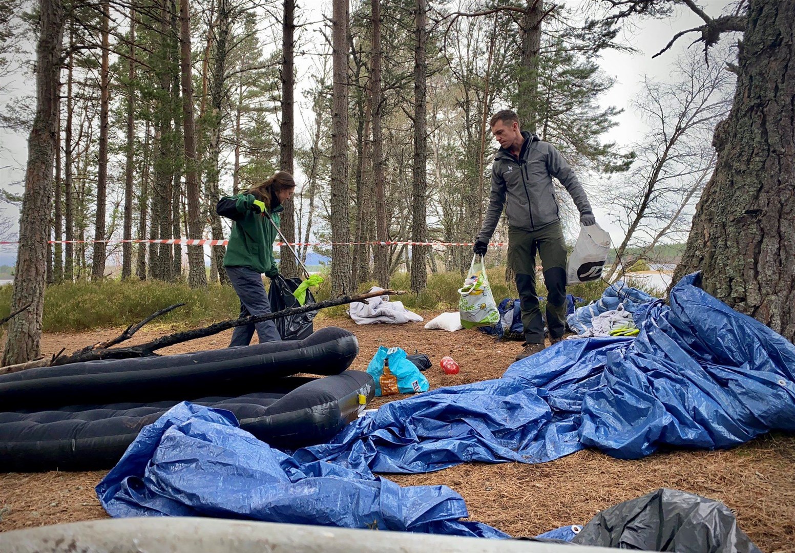CNPA rangers get to work clearing rubbish left by 'dirty campers' at the beauty spot.