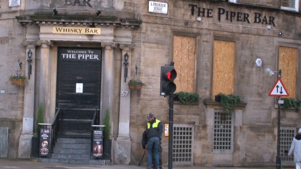 Boards were put on the windows of The Piper Bar shortly after the 6pm closing time (Douglas Barrie/PA)