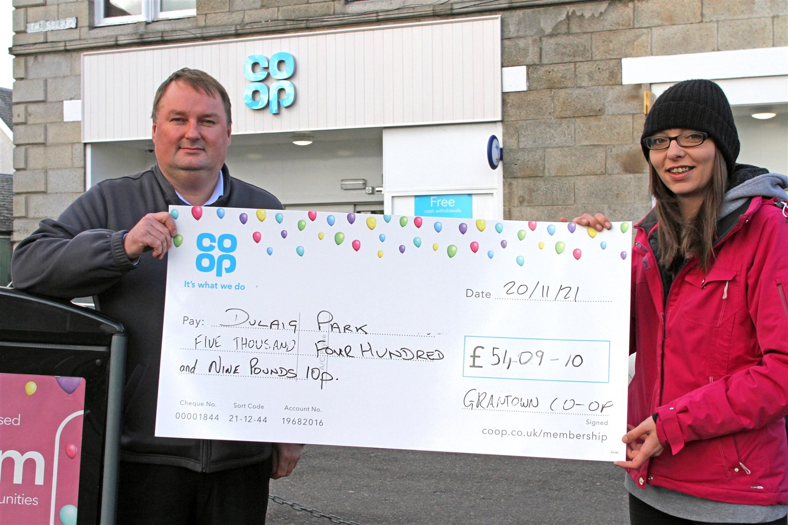 PLAY BOOST: Grantown Coop store manager Derek Blaney presents the Dulaig Park renovation project cheque to Debbie Mackie.