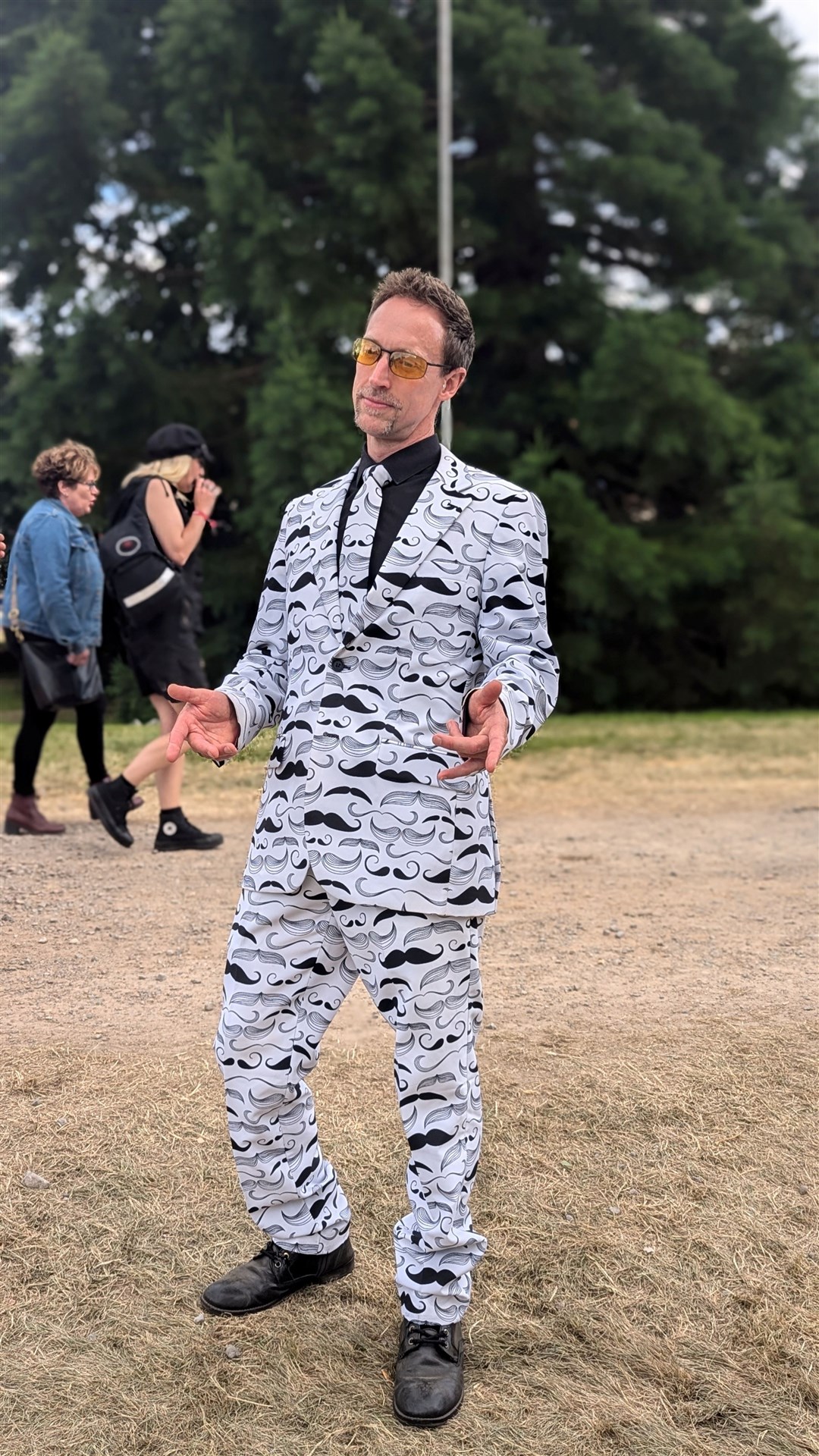 One man in a moustache suit.