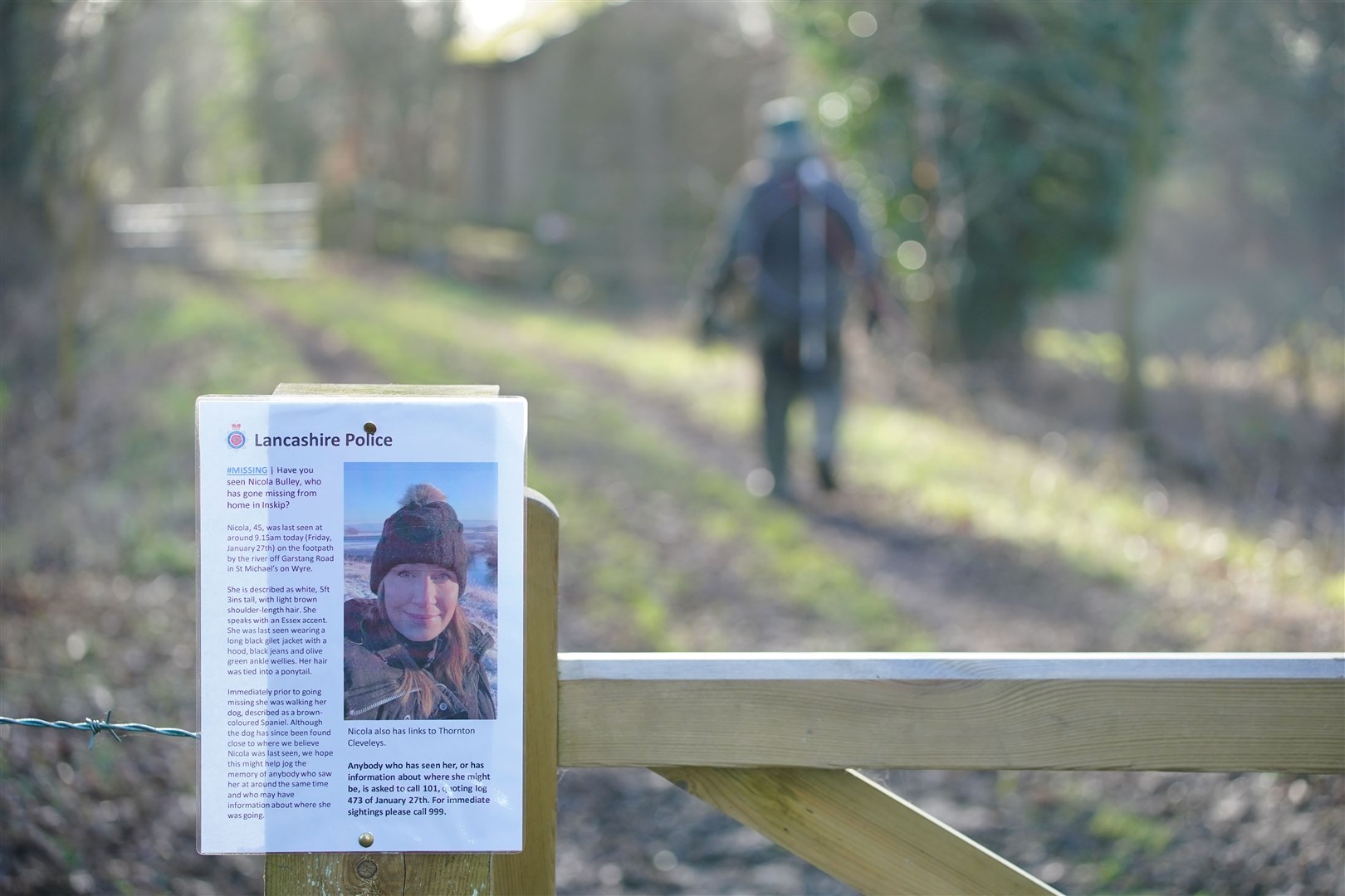 A missing person notice attached to a gate (Peter Byrne/PA)