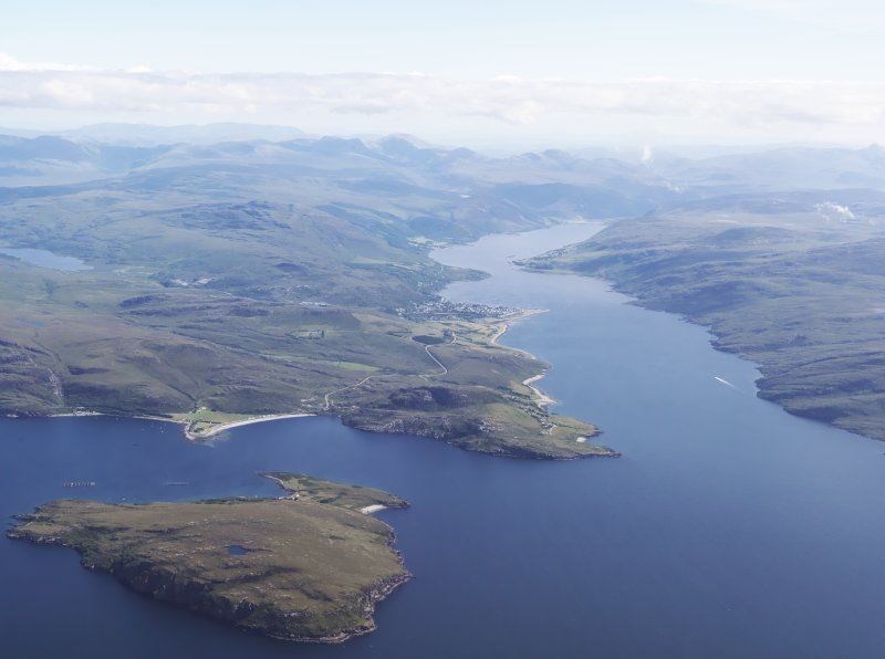 General oblique aerial view looking across Isle Martin towards Ardmair and Ullapool with Loch Broom beyond, taken from the north-west. Picture: © Crown Copyright: Historic Environment Scotland.