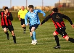 Pentland Utd striker Ross Allan starts another run at the Halkirk defence, with Lee Elder (left) and Michael Bremner trying to close him down.