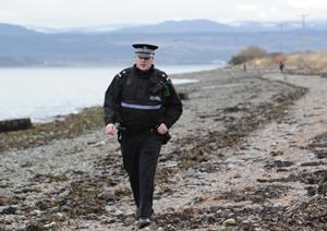 Police at the scene of the first find near Avoch.