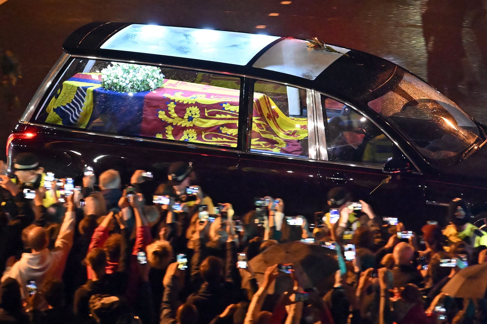 Thousands of well-wishers lined the streets for the hearse’s journey to the palace (Marco Bertonello/PA)