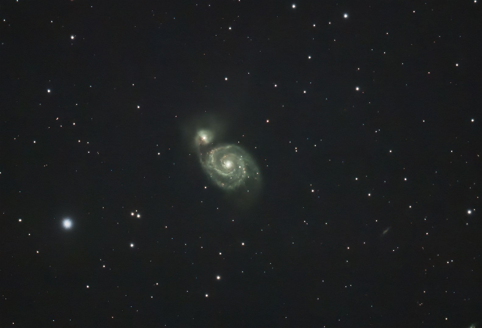 Finally moving even further out into inter-galactic space we have the Whirlpool Galaxy (M51a).The Whirlpool Galaxy is a grand spiral class galaxy and is interacting with a smaller galaxy M51b/NGC 5195.This galactic interaction is taking place 31 million light years from earth. This is a cropped image to show the interaction.