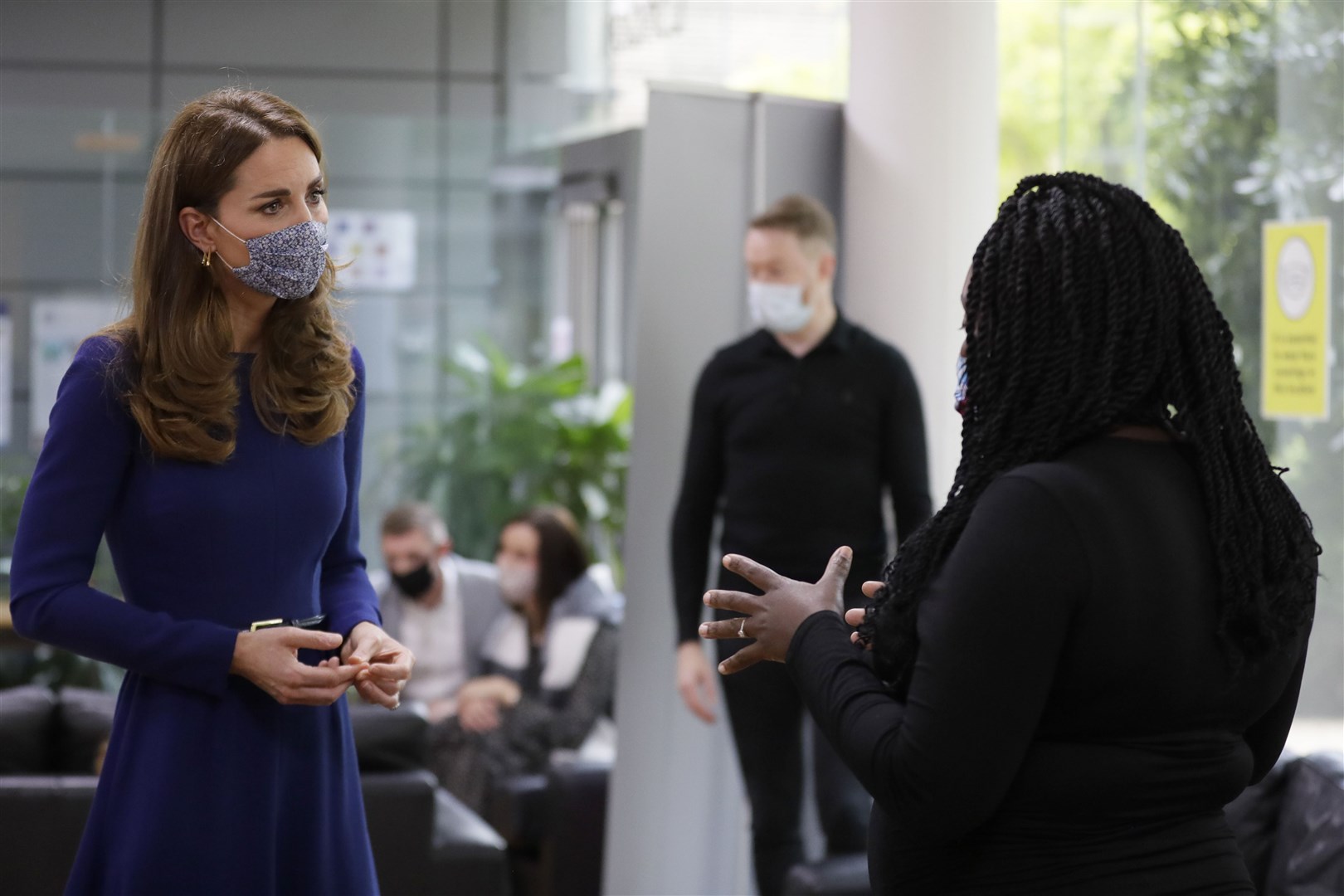 Kate speaks to Obiele Laryea, during a visit to the Institute of Reproductive and Development Biology (Kirsty Wigglesworth/PA)