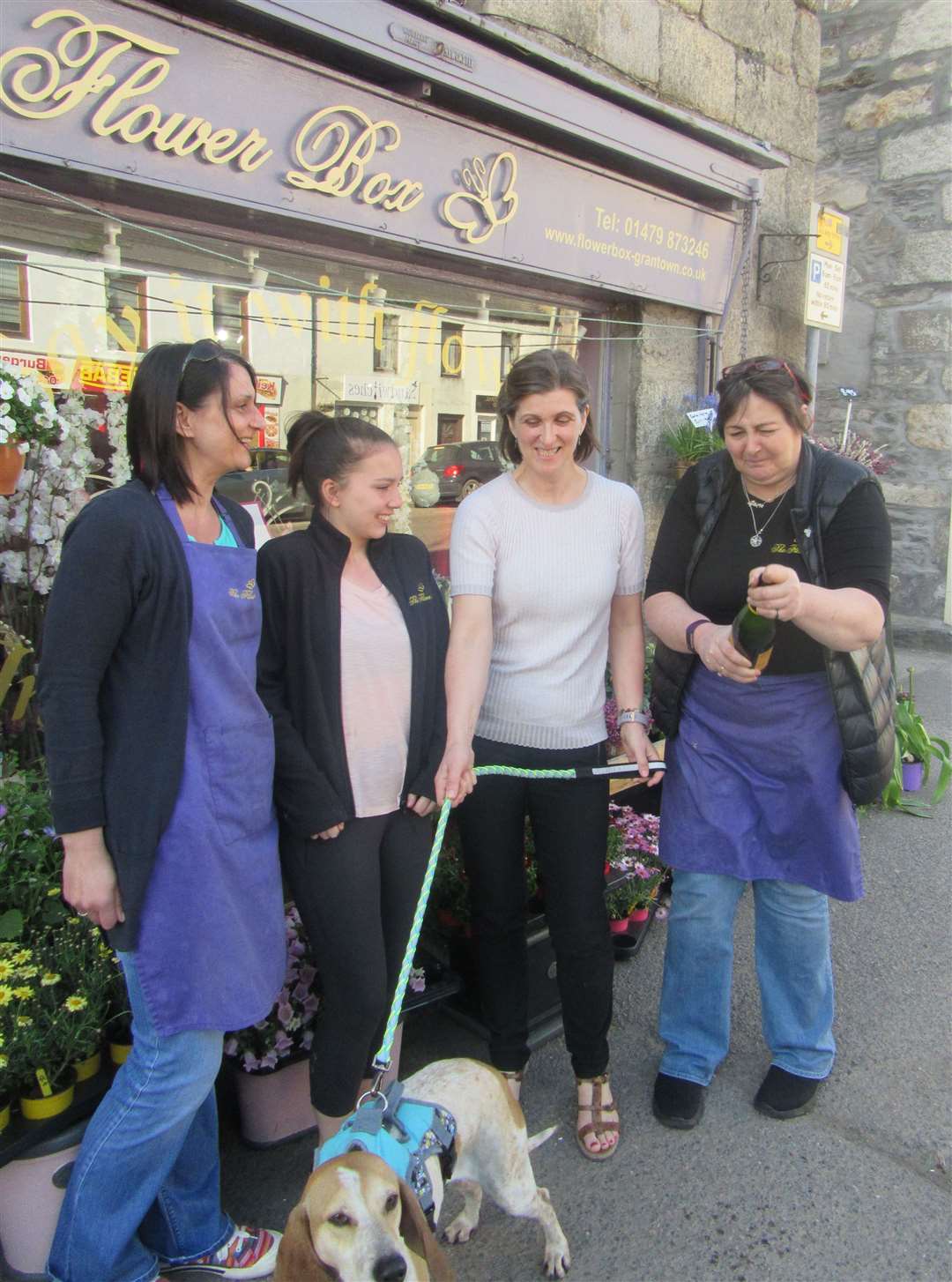 Will the champagne pop again this year? Maria Norman (right) with (from left) Candace and Sophie MacLean, Jane Stevenson and Oliver, celebrate last year’s win. The Flower Box will find out if it has won again on Tuesday.