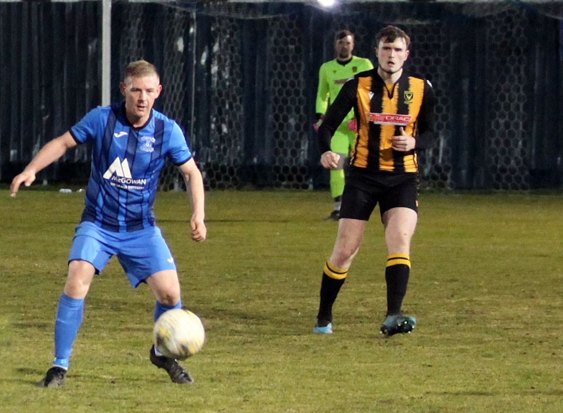 Kris Duncan (left) put Strathspey ahead in the 18th minute of the game... Photo: Frances Porter.