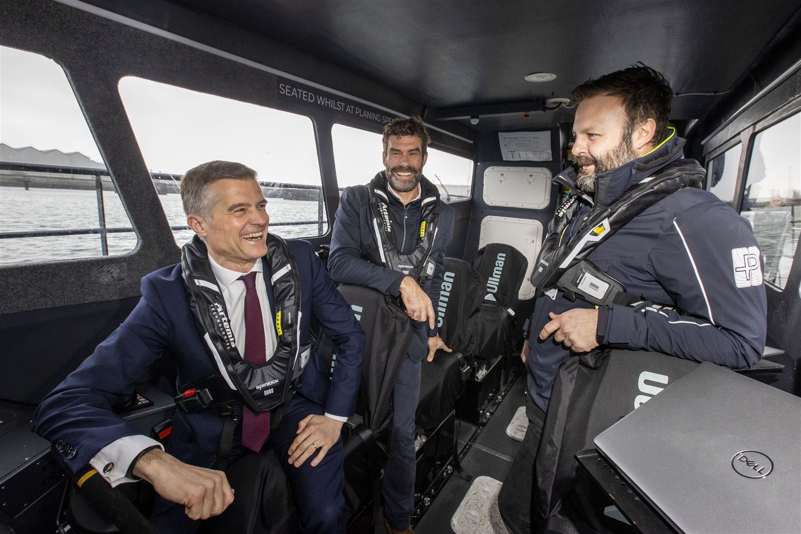 (l to r) Transport Secretary Mark Harper with Artemis Technologies CEO Dr Iain Percy and workboat master Stephen Milne (Liam McBurney/PA)