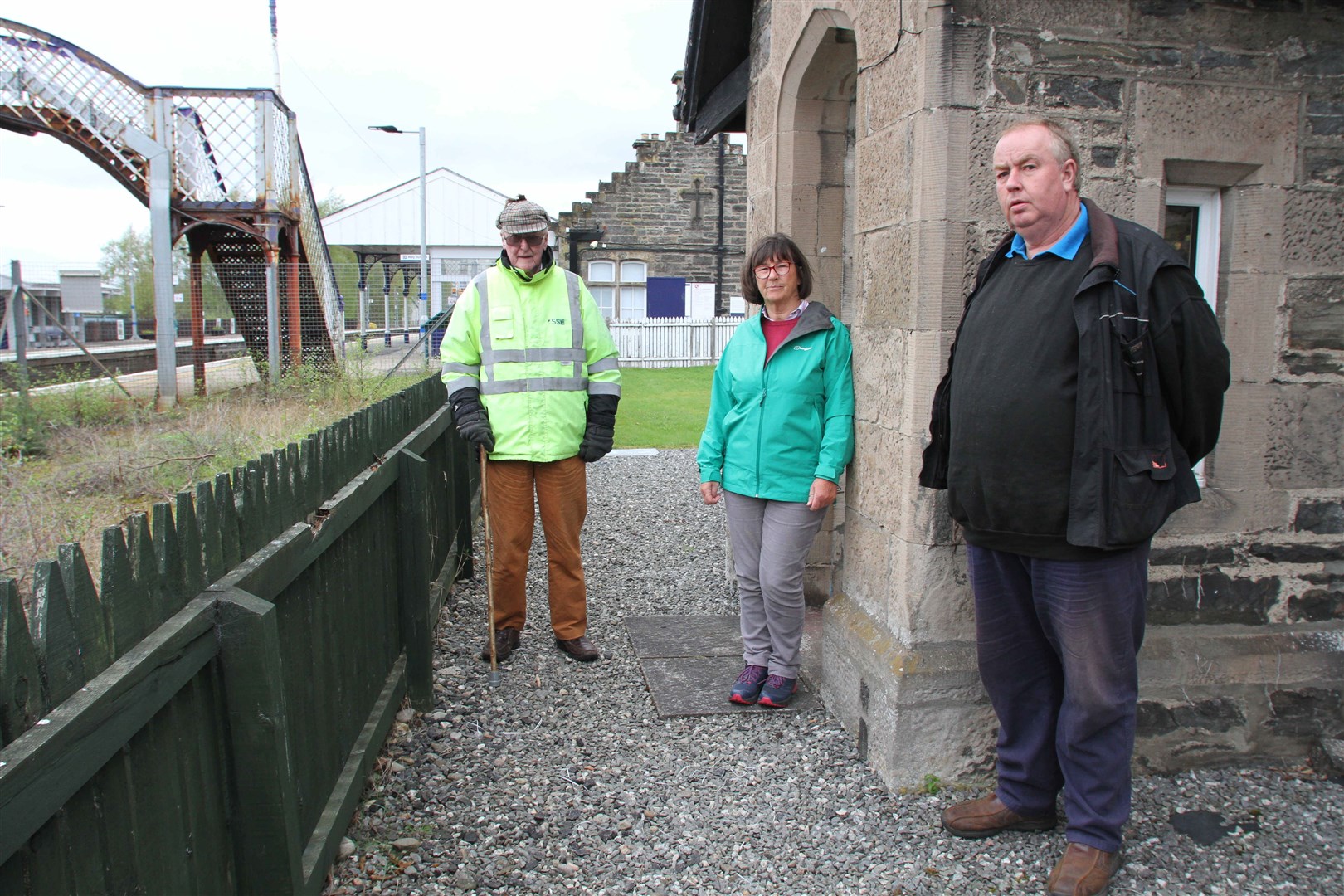 GETTING CROSS: Joe Taylor (left) with Kingussie Community Council members Janet Kinnaird and Ruaridh Ormiston at the Station Master’s House at the town’s railway station.