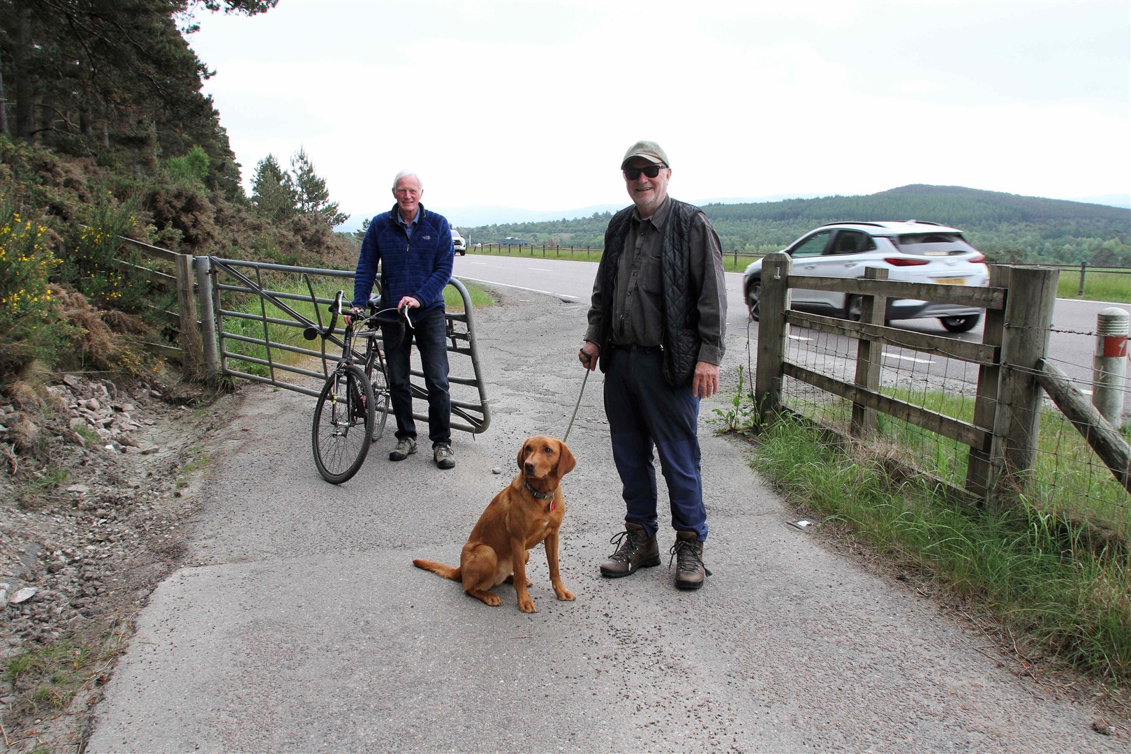 Nigel Williams and Charlie Whelan next to the busy A95 which is the only dedicated direct link between Dulnain Bridge and Grantown at this time.