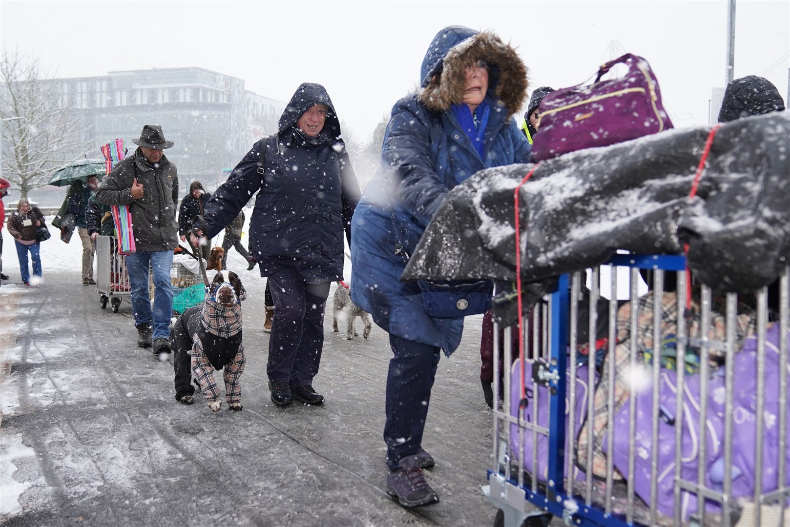 People arrive for the first day of the Crufts Dog Show (Jacob King/PA)