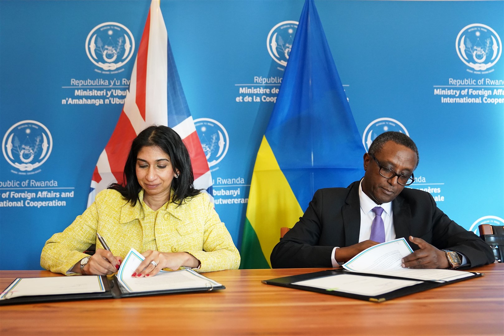 Suella Braverman and the Rwandan minister for foreign affairs and international co-operation, Vincent Biruta, sign an enhanced partnership deal in Kigali, during her visit to Rwanda (Stefan Rousseau/PA)