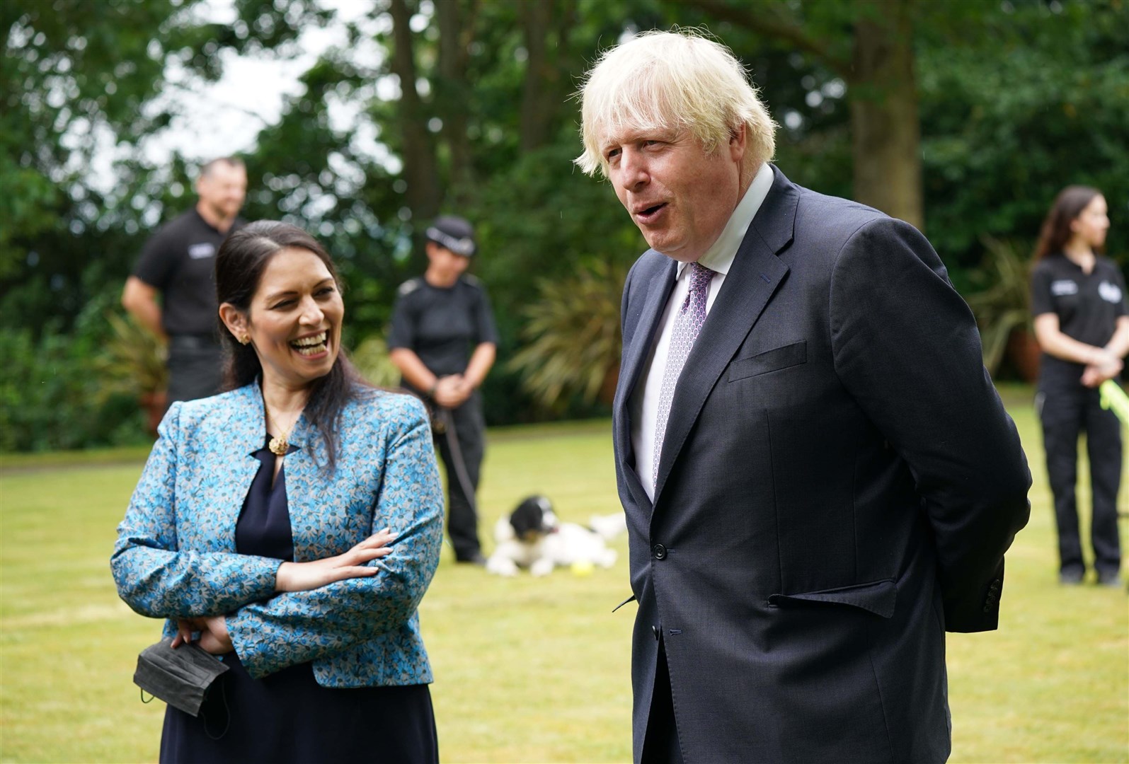 Prime Minister Boris Johnson and Home Secretary Priti Patel during a visit to Surrey Police headquarters in Guildford (PA)
