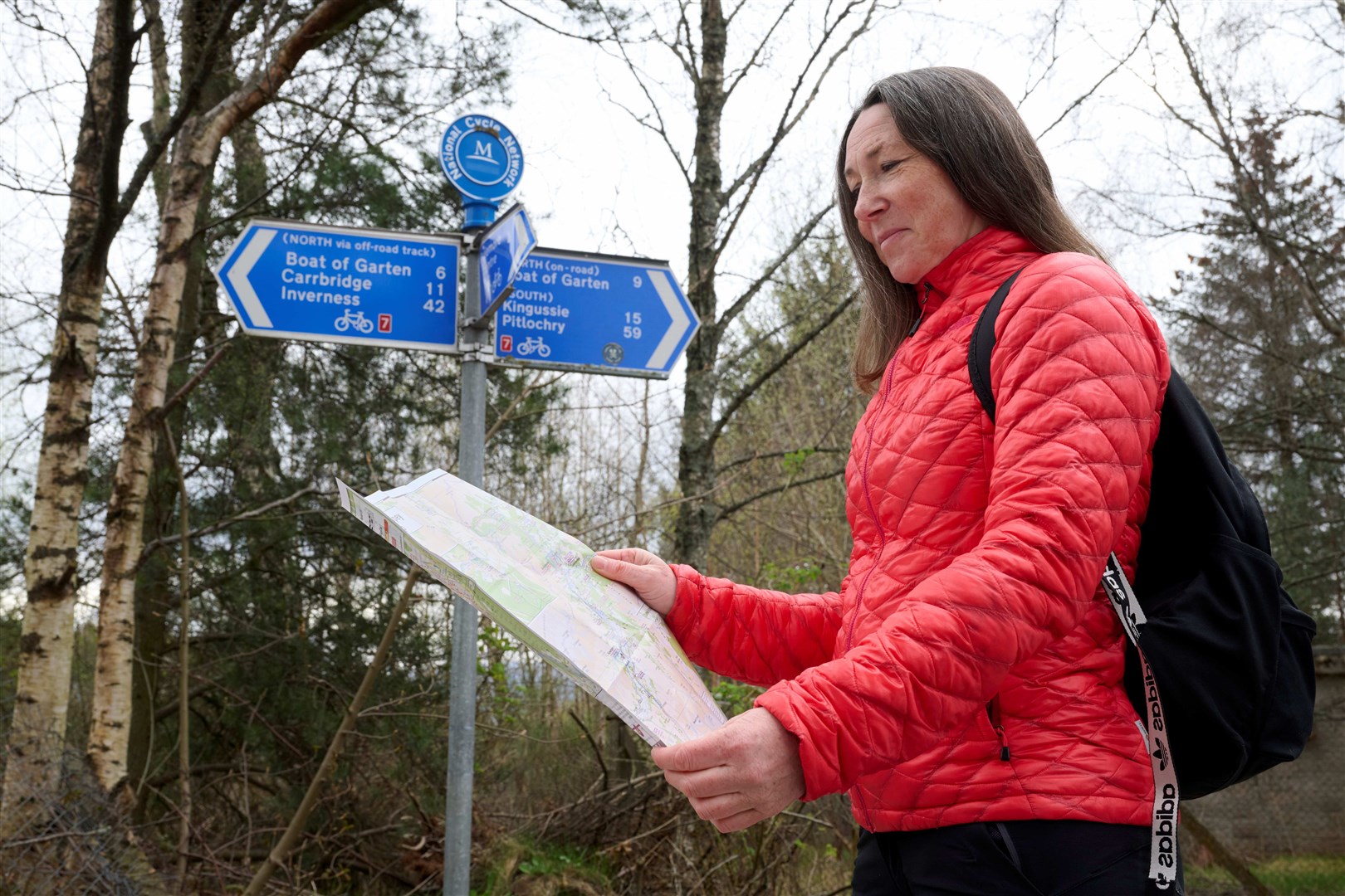 Sheena Corcoran using the map to navigate her way on a walk in the strath.