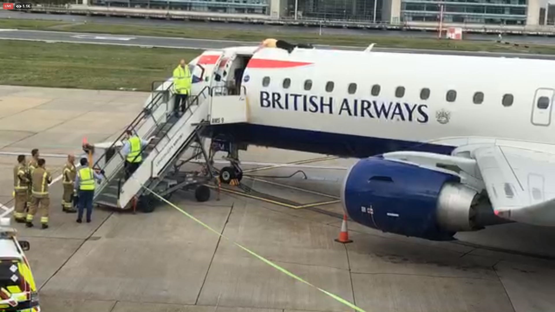 Paralympian James Brown lying top of a British Airways plane at City Airport, London (Extinction Rebellion/PA)
