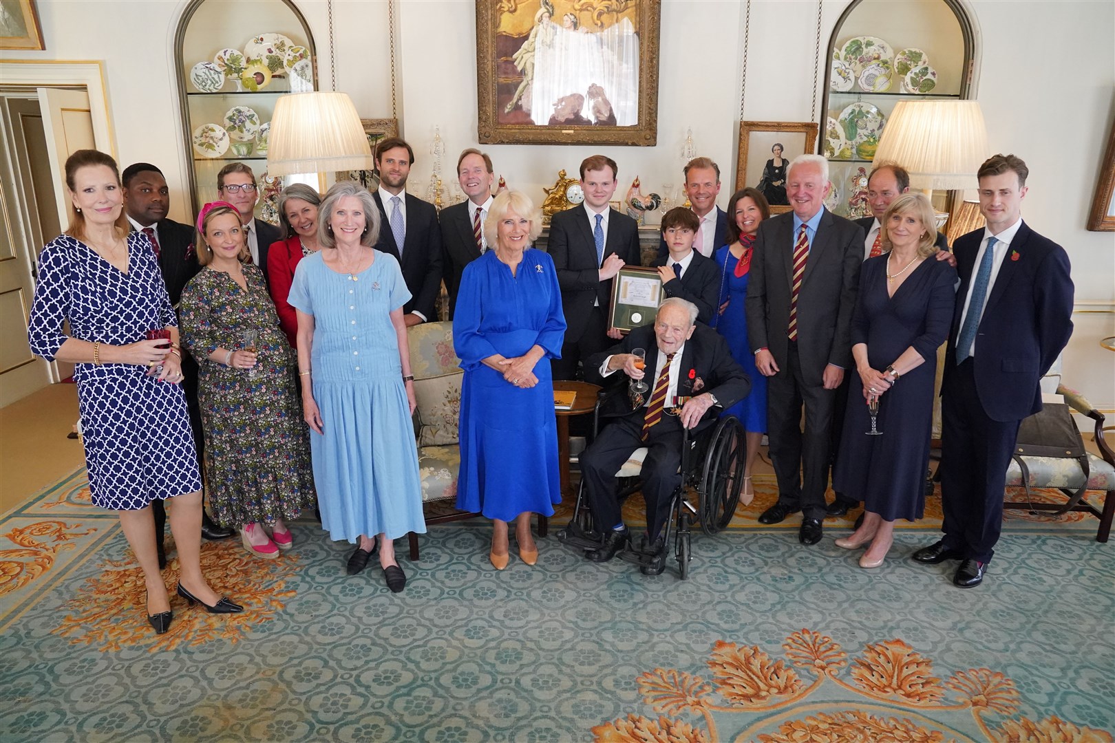 Queen Camilla hosts a reception with current and past members of the regiment and Michael De Burgh and his family (Jonathan Brady/PA)