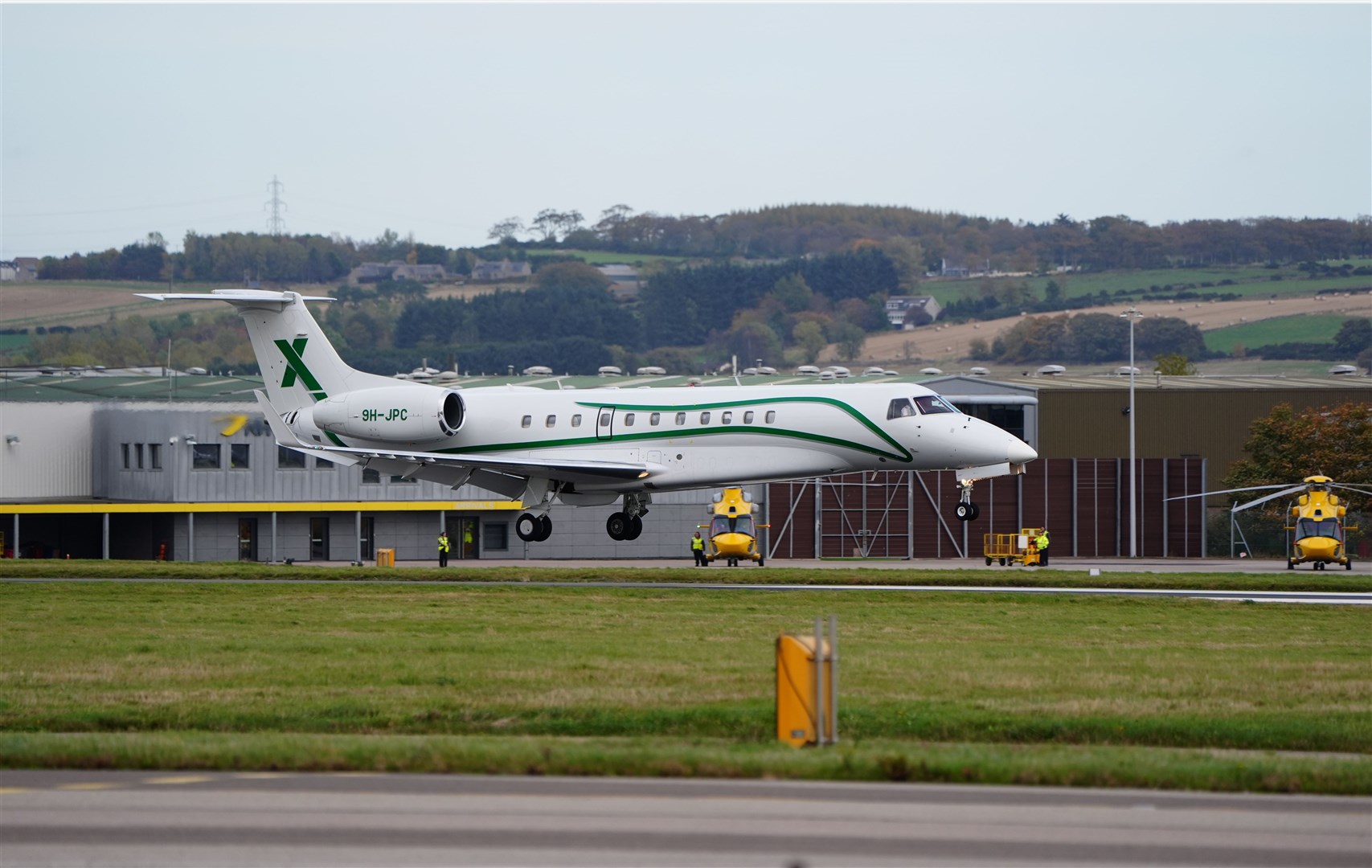 The plane carrying the body of former first minister of Scotland Alex Salmond lands at Aberdeen Airport (Jane Barlow/PA)