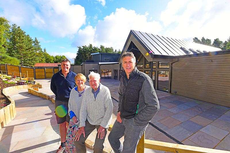 The Lambie family in front of the new premises – the Speyside Centre – developed after the devastating blaze.