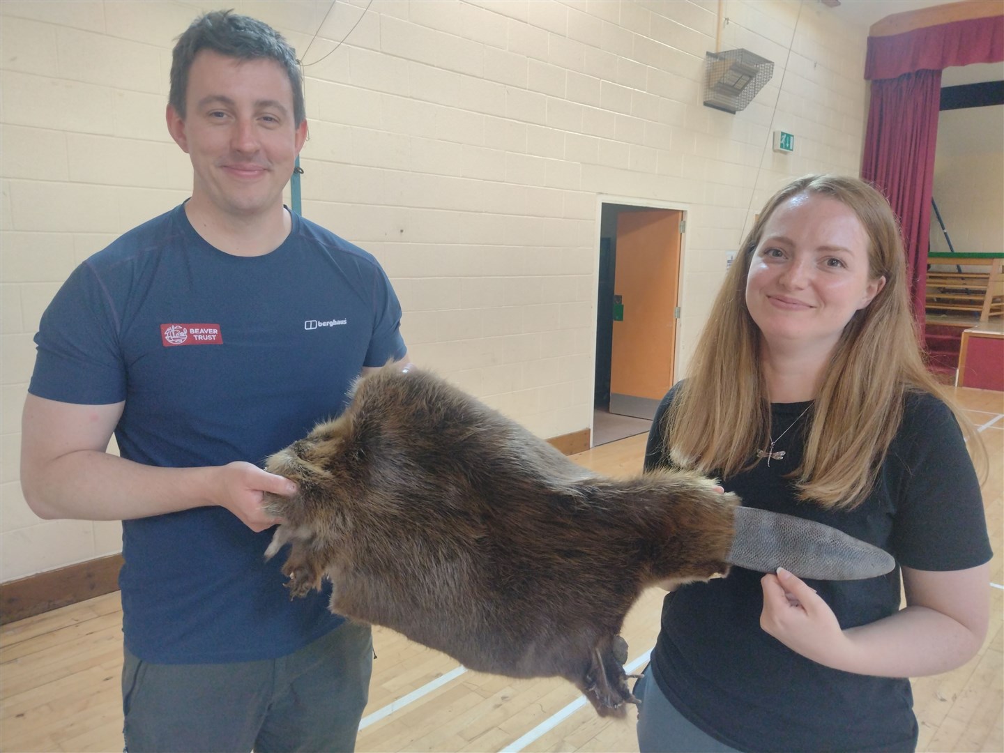 Beaver Team members Elliot McCandless and Alana Skilbeck with a beaver pelt at Kincraig.
