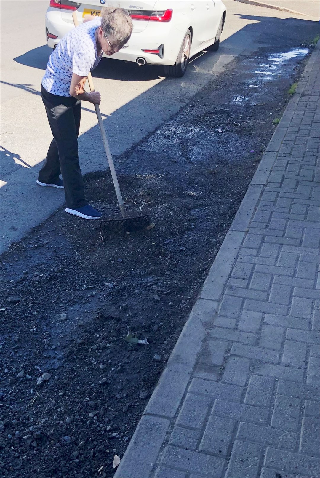 Jenny hard at work levelling the problem area outside her home in Halkirk.