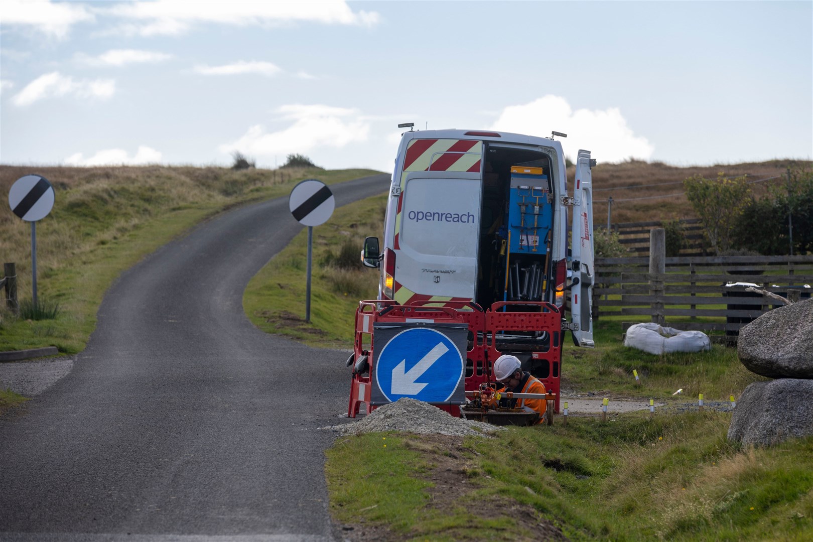 Van by single track road carrying out works to install full fibre broadband technology.