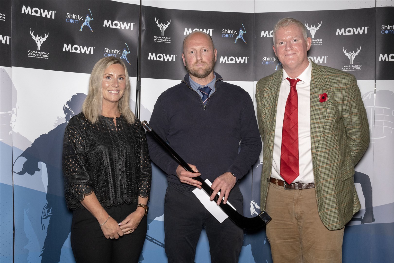 Mowi Coach of the Year (Premiership and National) John Gibson of Kingussie, presented with the award by Mowi's Jayne Mackay (left) and Dougie Hunter at last year's ceremony.