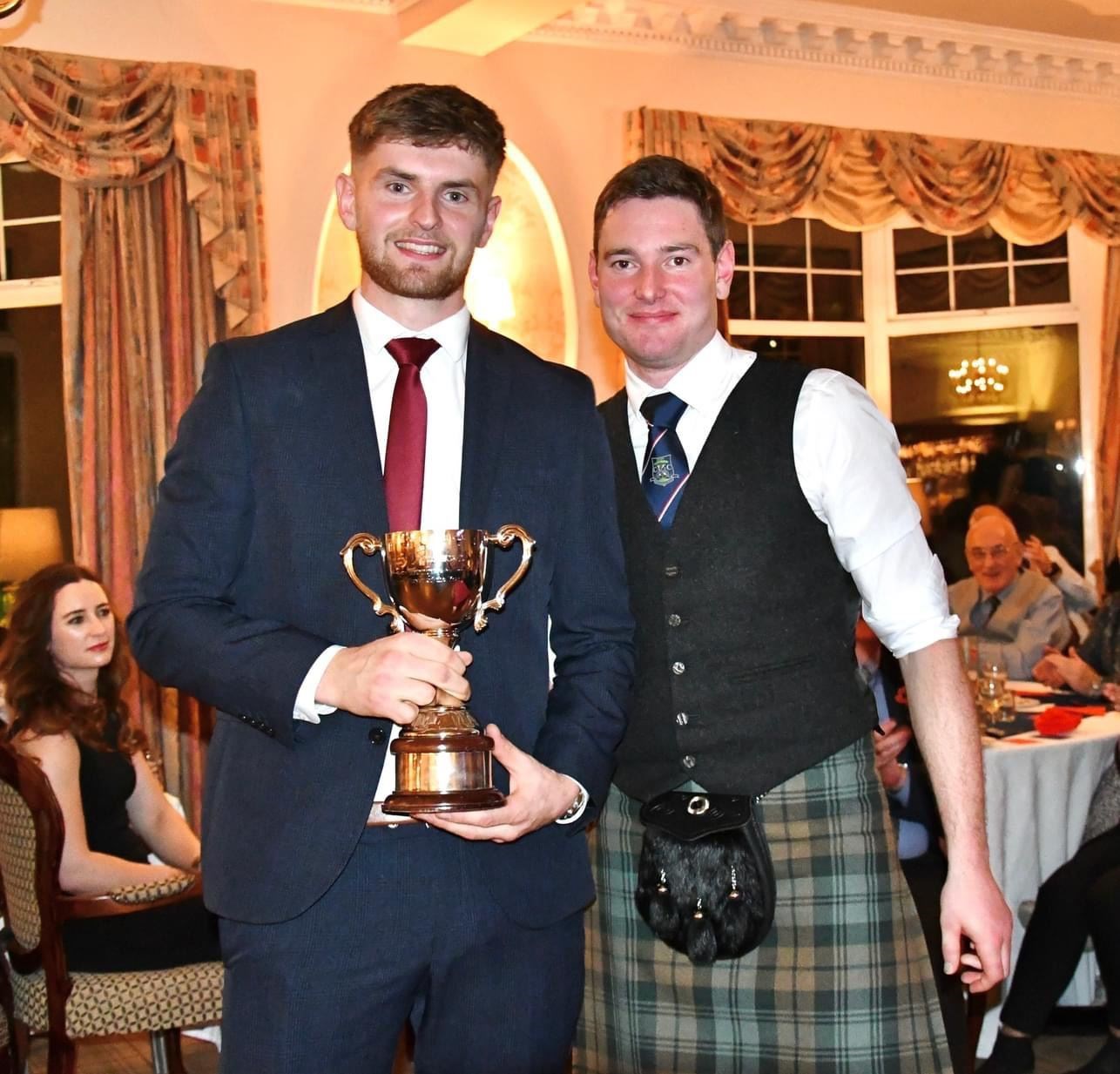 Alexander Michie received his well-deserved award from skipper Calum Grant.
