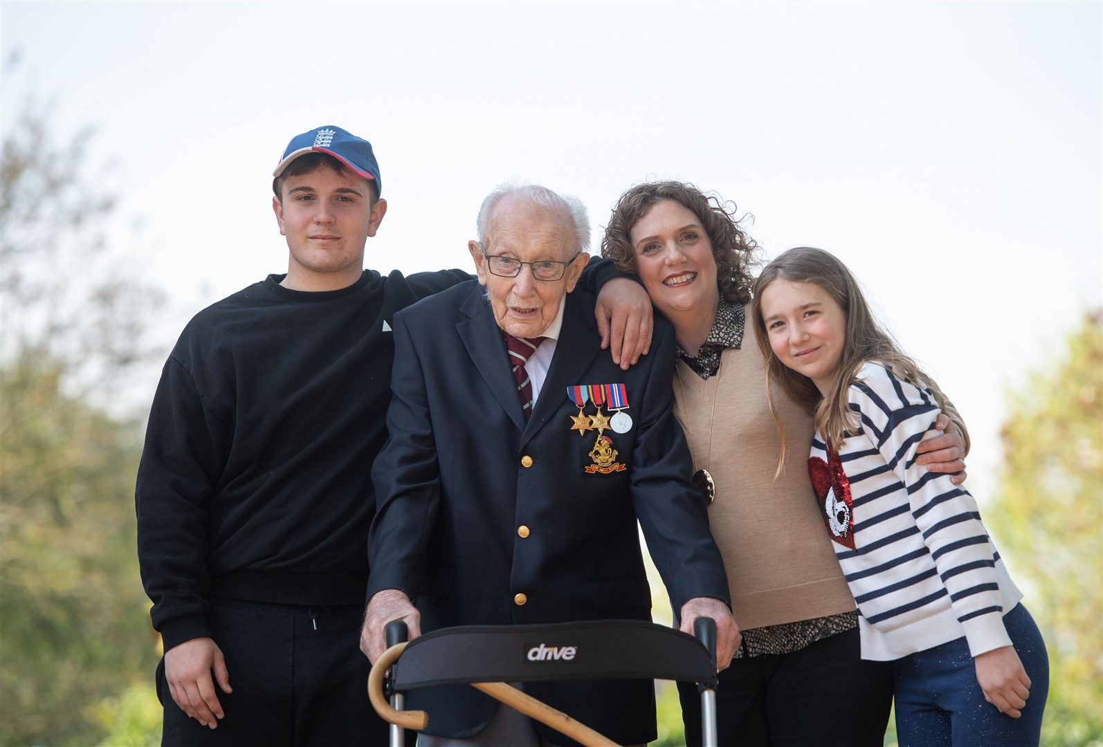 Captain Tom with grandson Benji, daughter Hannah Ingram-Moore and granddaughter Georgia (Joe Giddens/PA)