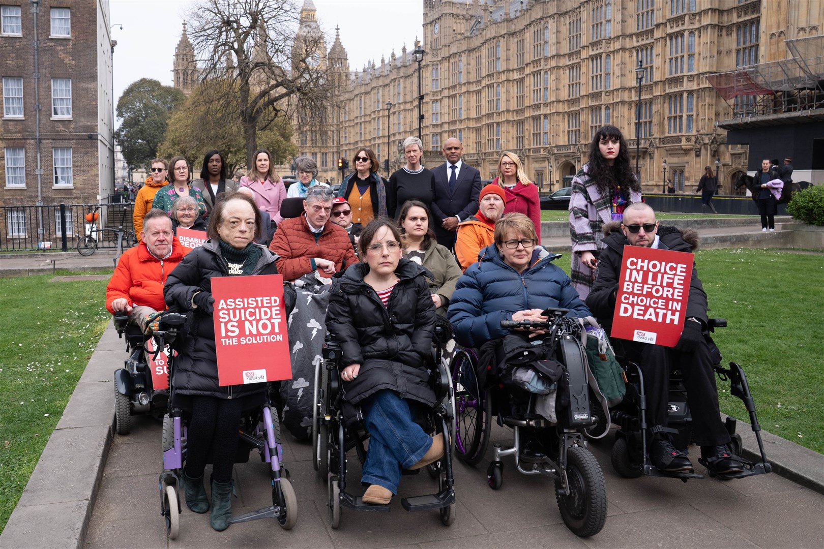 Campaigners including actress Liz Carr and Baroness Grey-Thompson outside the Houses of Parliament (Stefan Rousseau/PA)