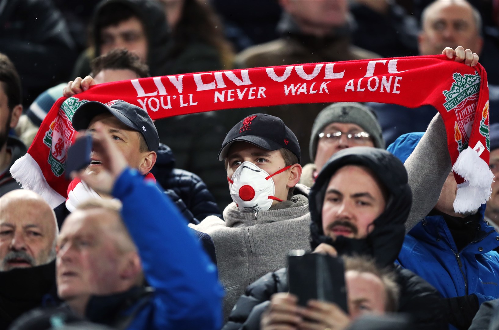 Football matches including Liverpool’s clash with Atletico Madrid continued to take place with fans at grounds in early March 2020 (Peter Byrne/PA)