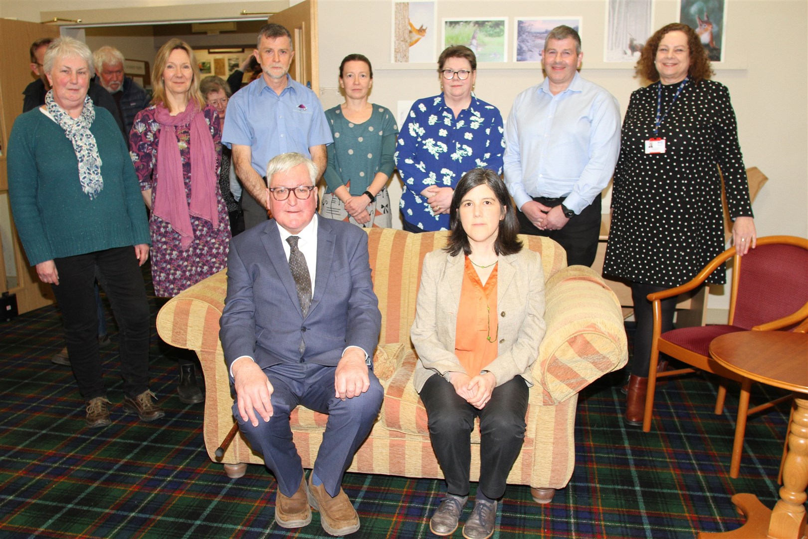 Fergus Ewing (seated) at the recent public meeting held by Grantown GPs and staff who are also pictured.