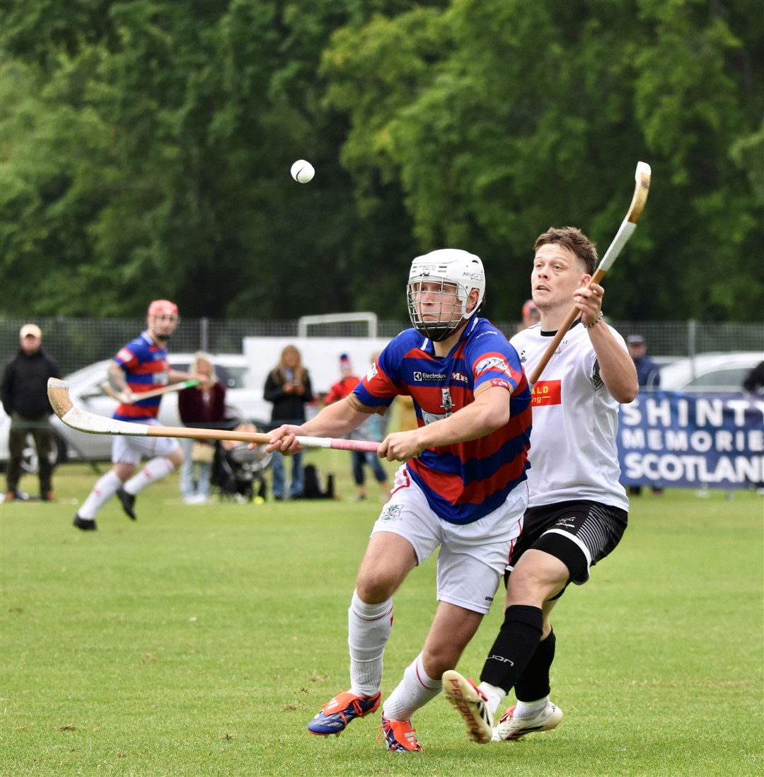 Kings goalscorer Roddy Young and Lovat's Martin Mainland keep a close eye on the ball.
