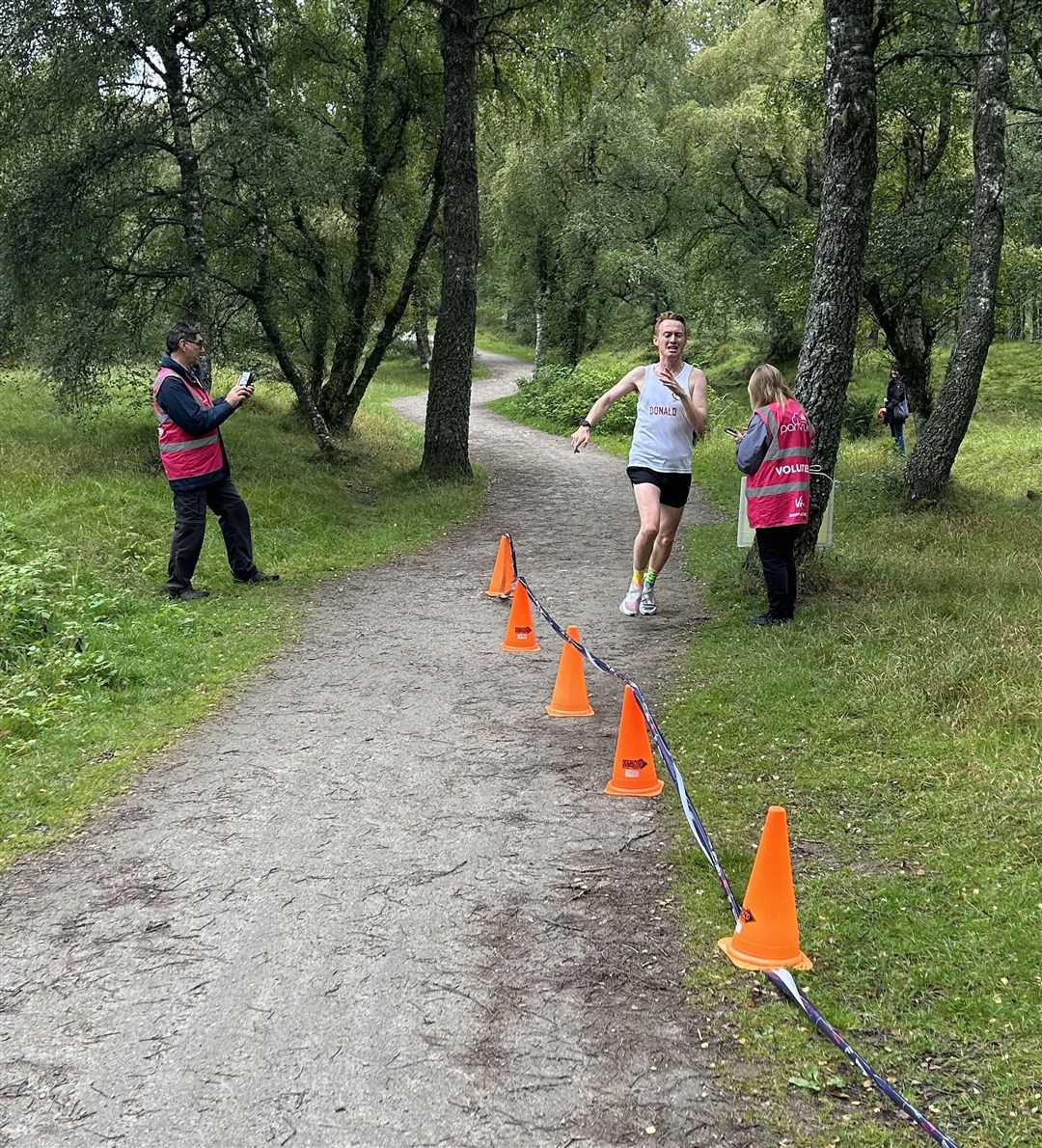 Donald Bennet crossing the line in 17 minutes 1 second…. a 1 second PB!