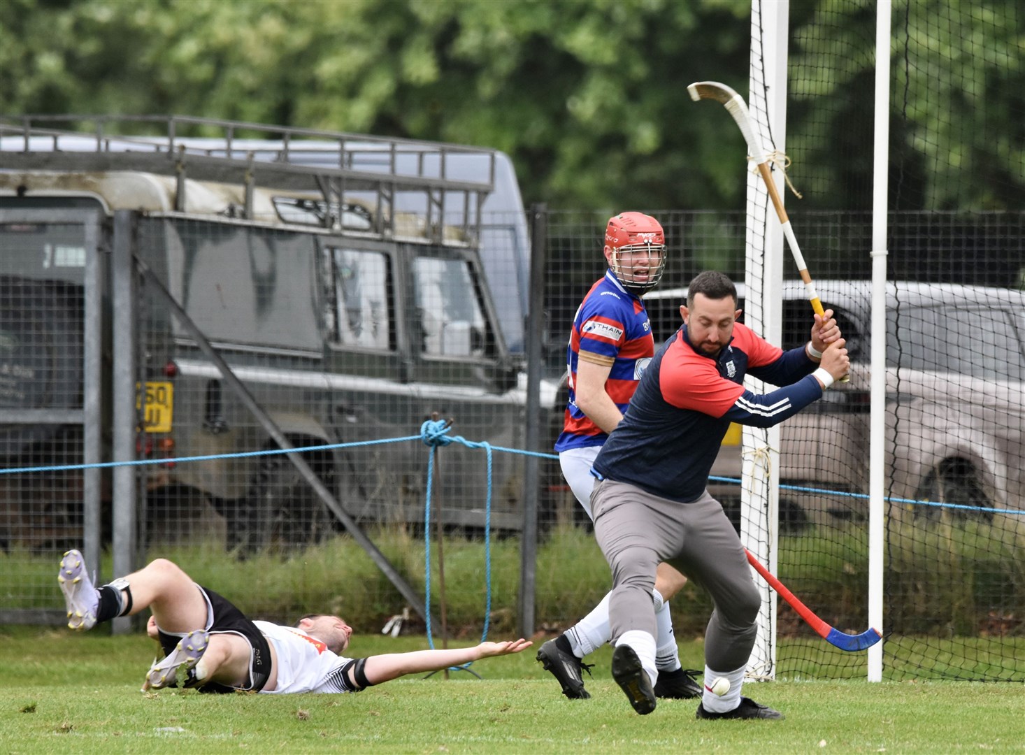 Keeper Bob McGregor clears the danger as Calum Grant looks on and Lovat's Greg Matheson lies stranded.