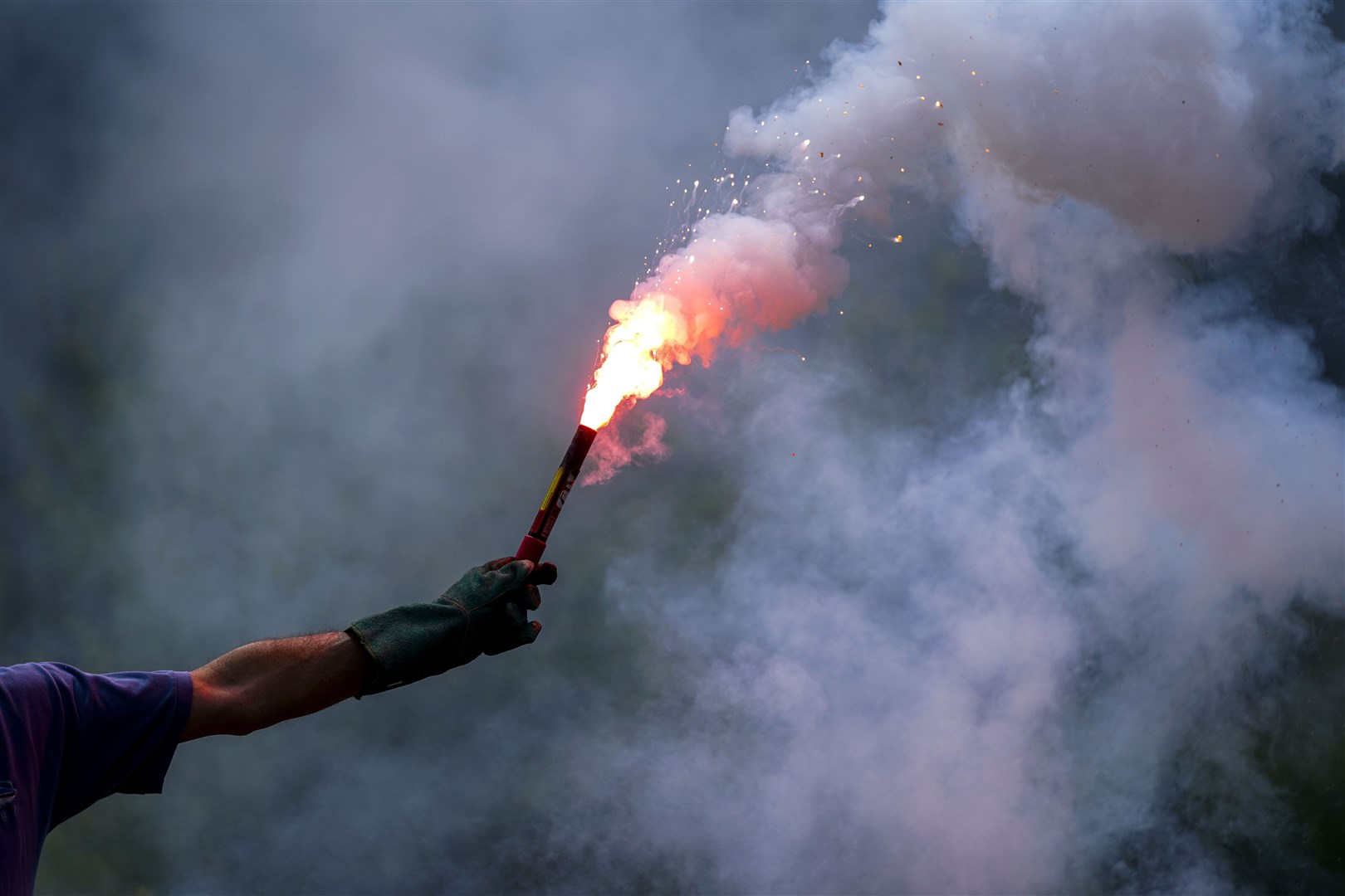 An instructor demonstrates a flare during ditching training for GAT2021 (Steve Parsons/PA) 