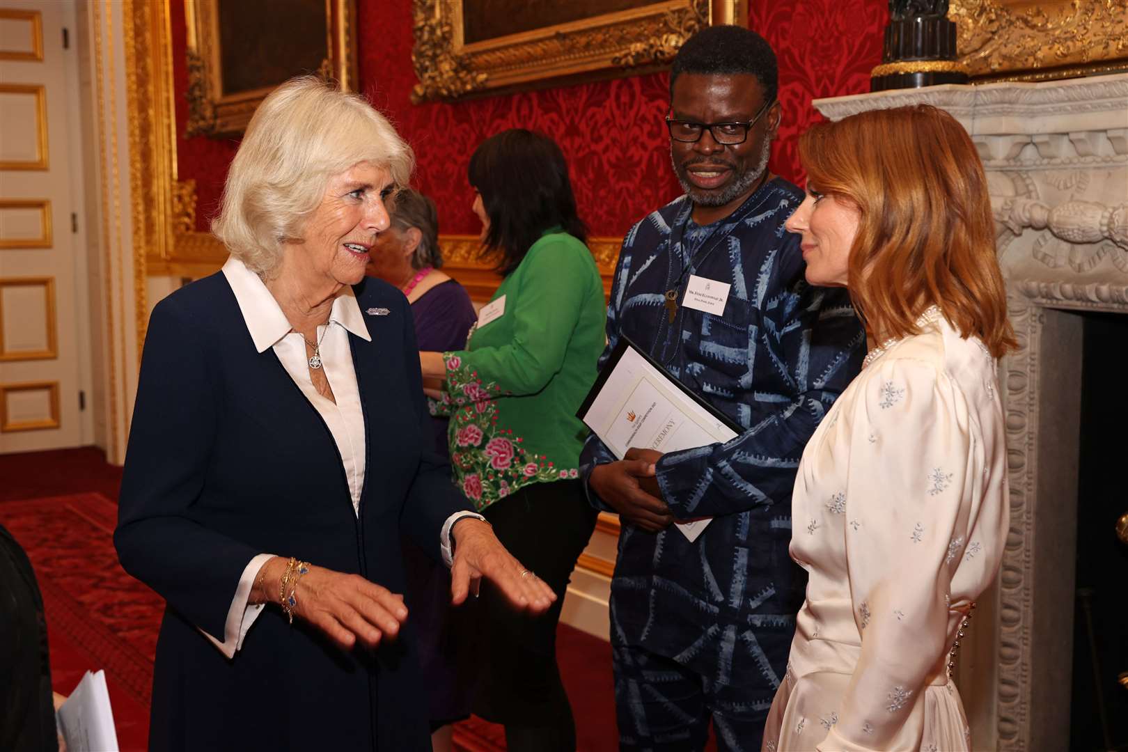 The Duchess of Cornwall meets Femi Elufowoju Jr and Geri Horner during the awards ceremony for the essay competition (Chris Jackson/PA)
