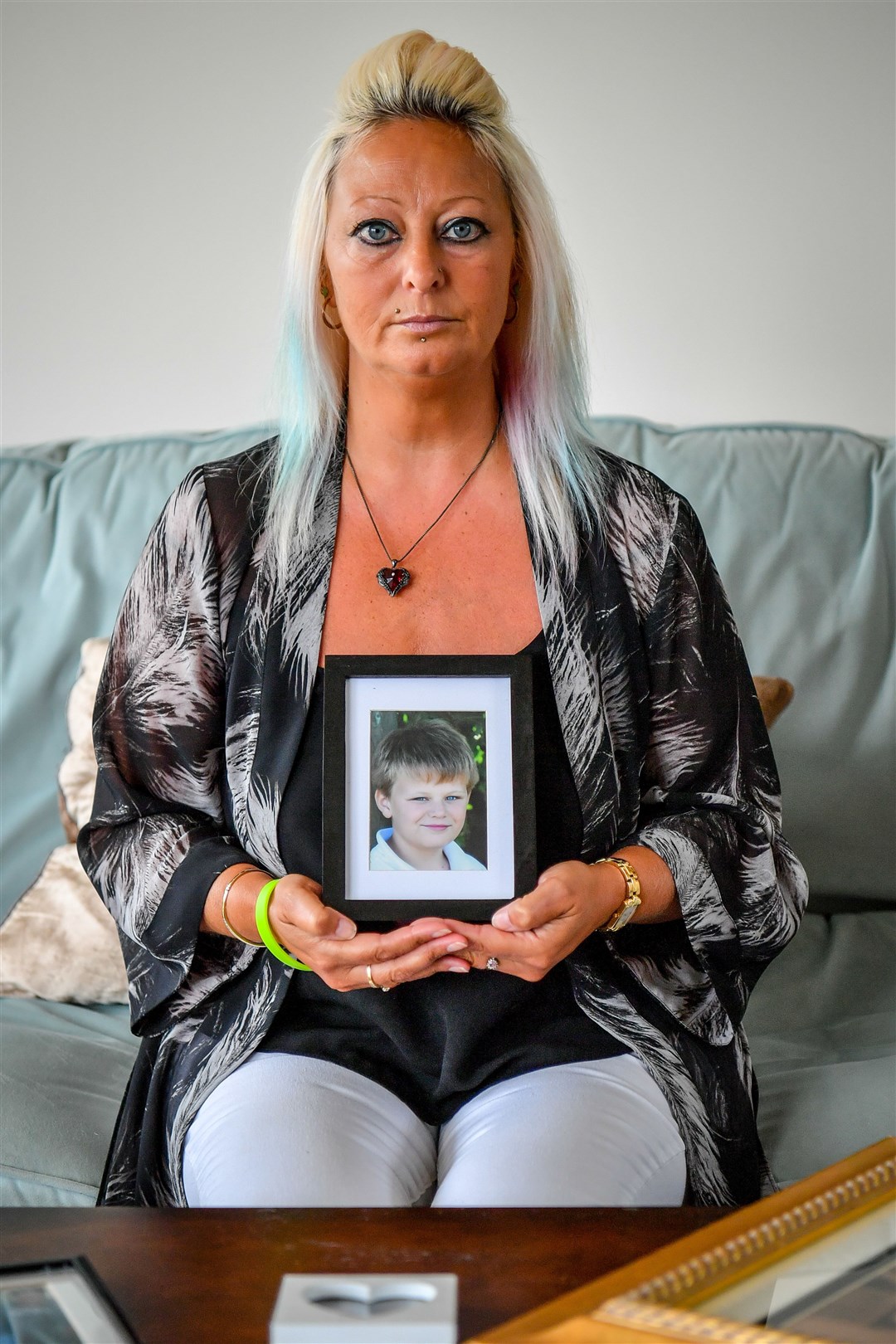 Charlotte Charles, mother of Harry Dunn, holding a photograph of him aged 14 (Family Handout/PA)