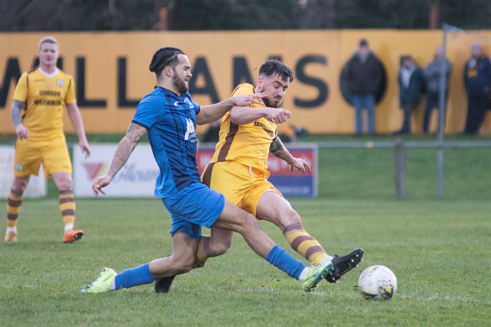 Strathspey Thistle's Connor Austin and Forres' Martin Groat compete...Forres Mechanics FC (8) vs Strathspey Thistle FC (1) - Highland Football League 22/23 - Mosset Park, Forres 07/01/23...Picture: Daniel Forsyth..