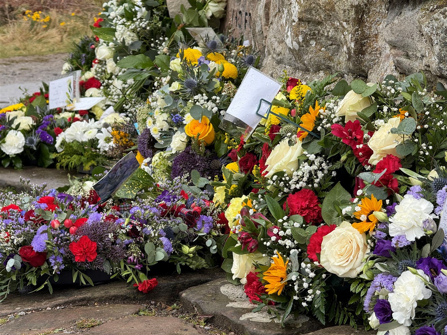 Some more of the beautiful memorial bouquets and tribute notes.