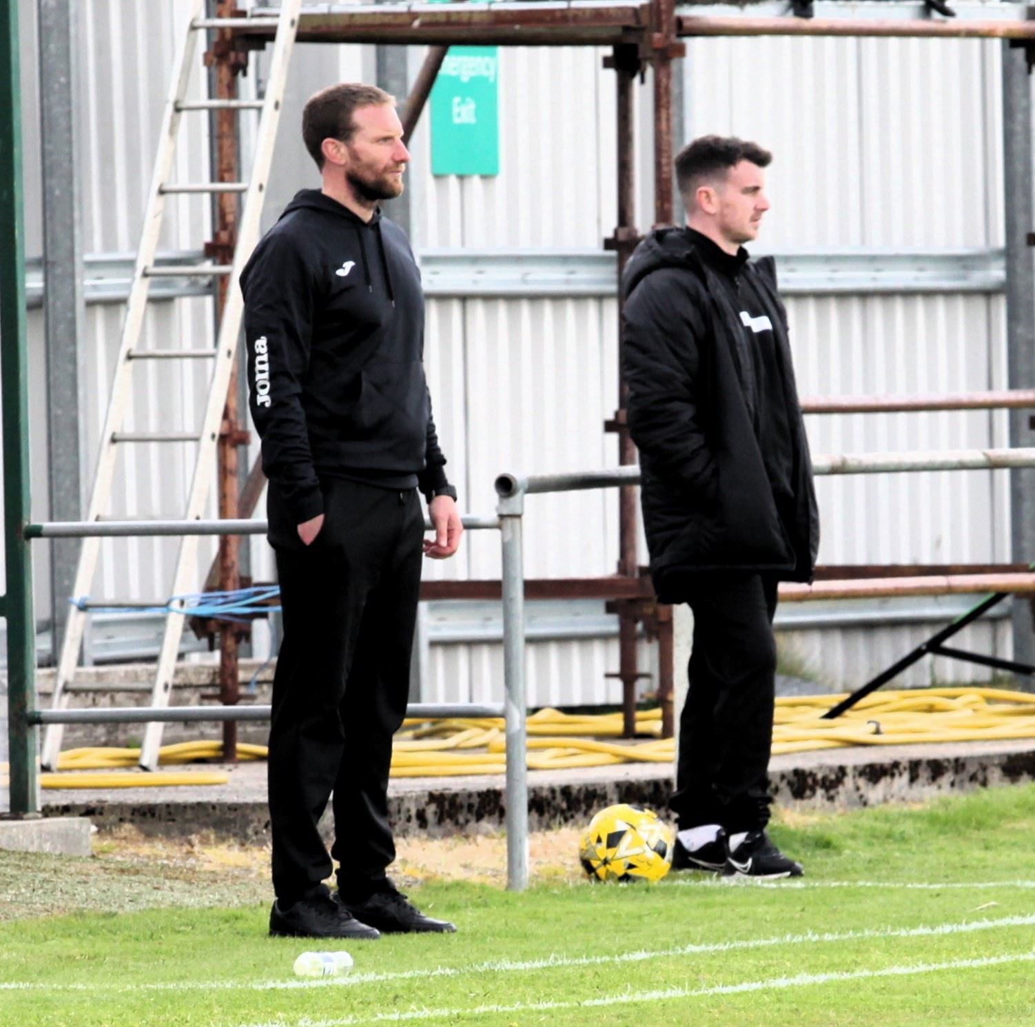Jags boss Ryan Esson and assistant coach Aaron Doran watch on from the sidelines.