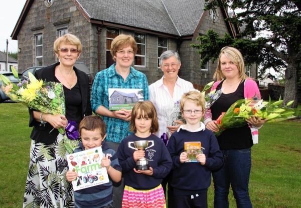 Pictured at the final prizegiving at Dalwhinnie Primary School are pupils from left Luke Fox (nursery), Niamh Wallace (P2) and Charlie Phillips (P3). Behind are staff members Jan Filshie (head teacher), Aileen Sellar (Support), Moira Webster (class teache
