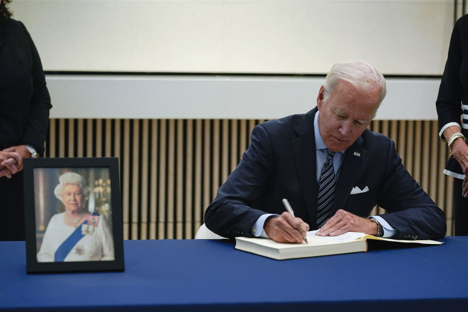 President Joe Biden signs a condolence book at the British Embassy in Washington (Susan Walsh/PA)