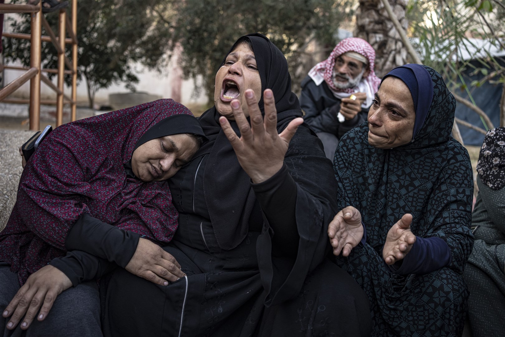 Palestinians mourn their relatives killed in the Israeli bombardment of the Gaza Strip on Saturday (Fatima Shbair/AP/PA)