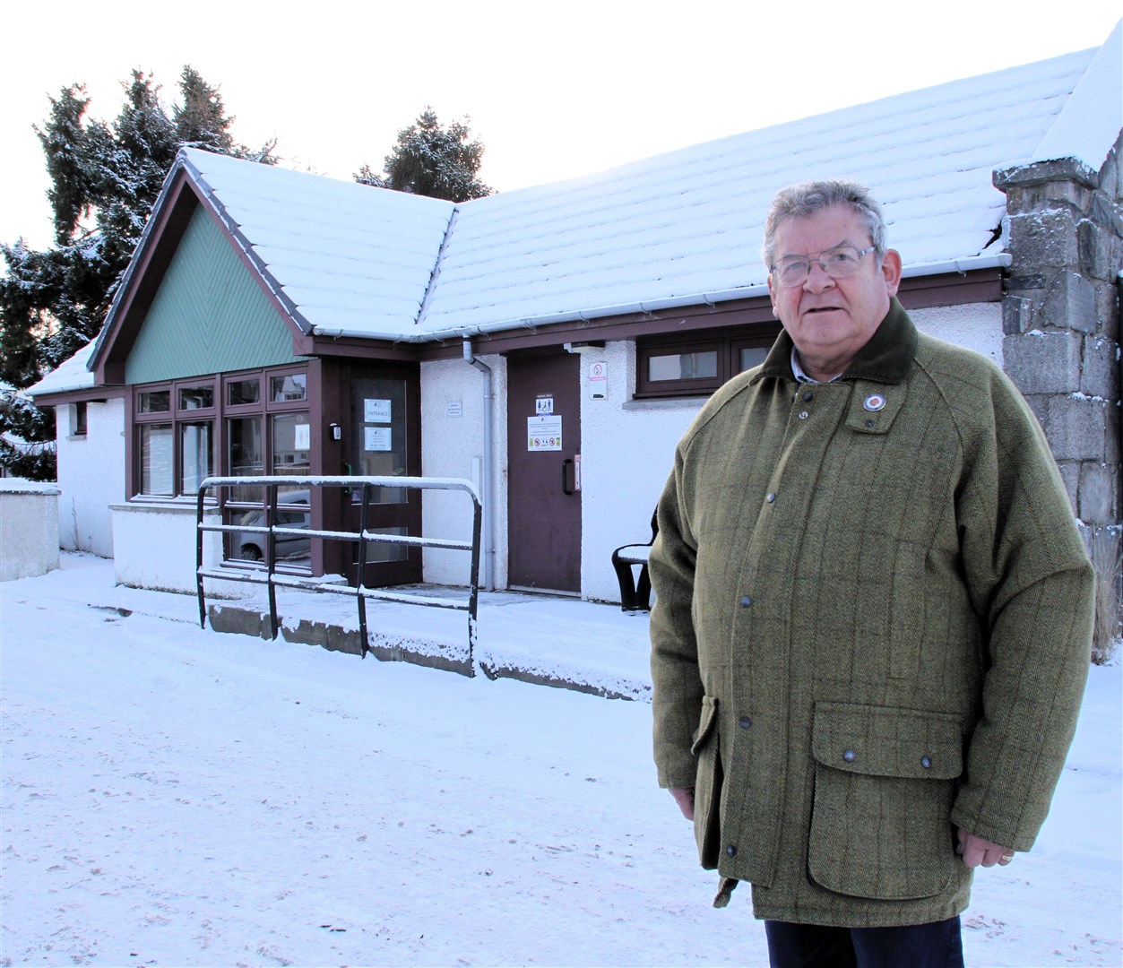 Going down the pan... Grantown watchdog secretary Ewan McGregor in front of the High Street toilets last week.