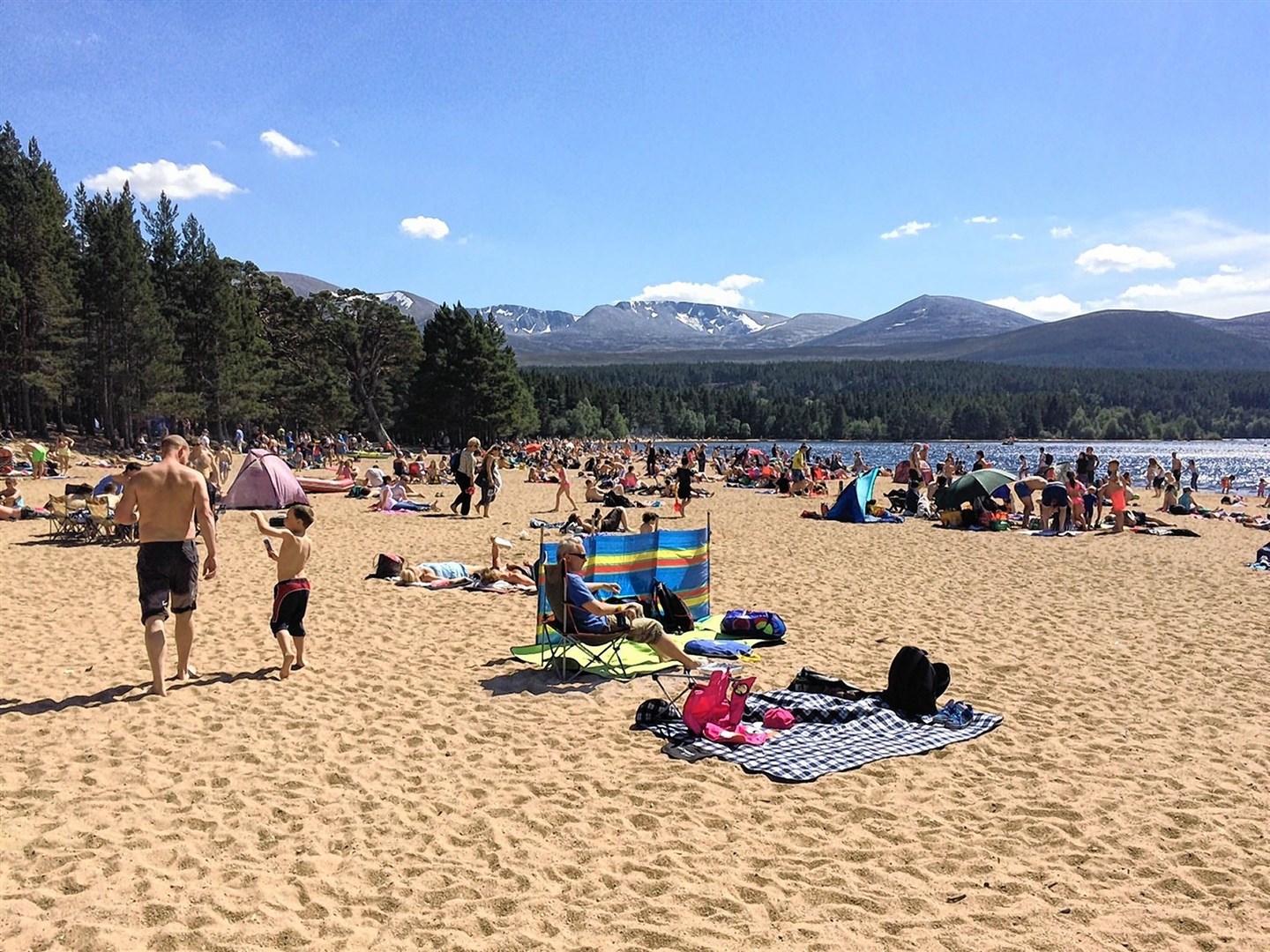 Loch Morlich beach is a very popular attraction in the good weather.