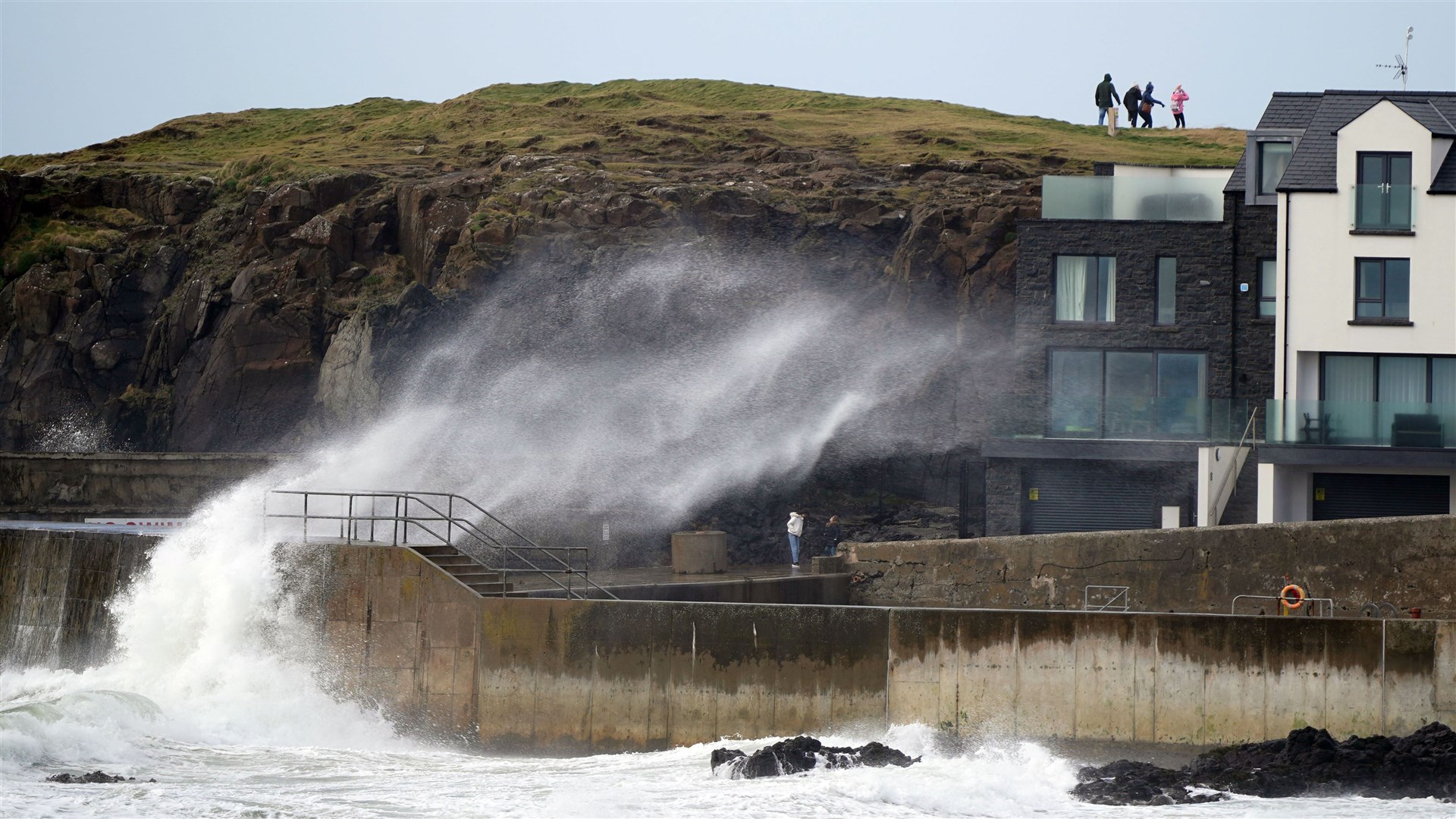 Big waves hit the sea wall at Portstewart in Co Londonderry, Northern Ireland (Niall Carson/PA)