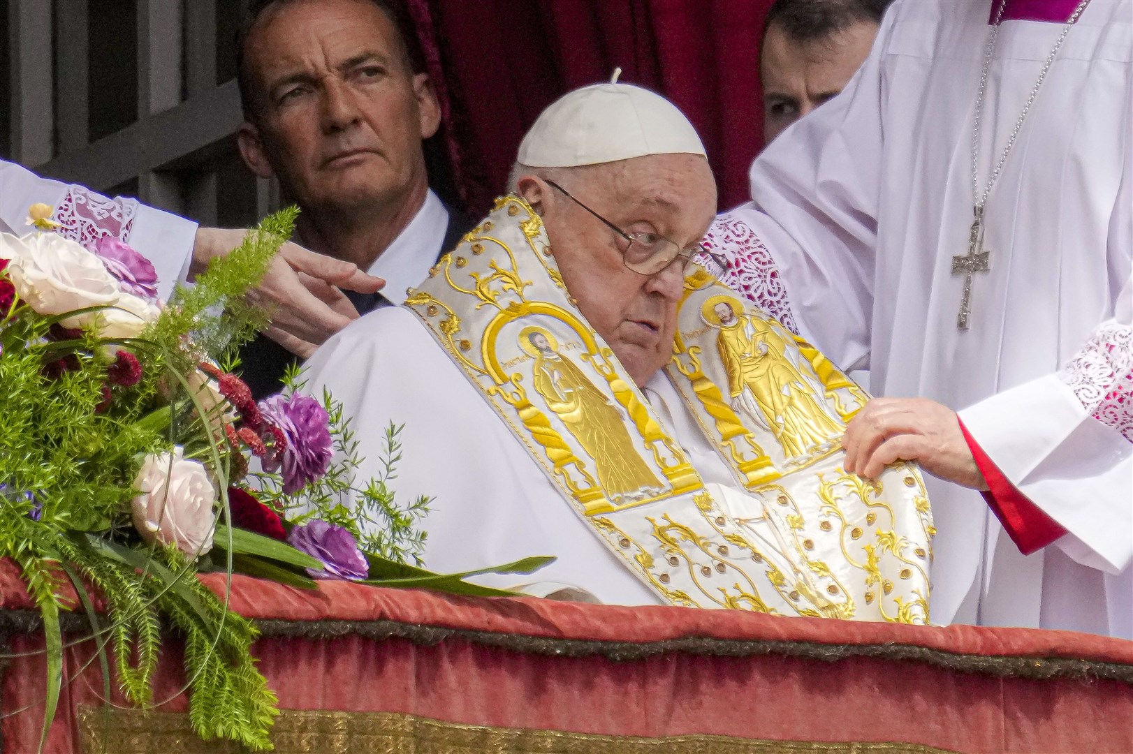 The Pope appeared on the central lodge of St Peter’s Basilica on Sunday, one of his few public appearances since developing pneumonia in February (Gregorio Borgia/AP)